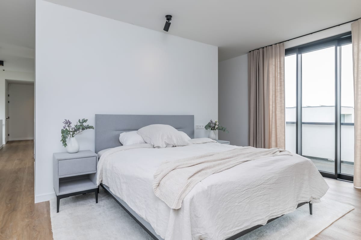 Principal bedroom with bed wall