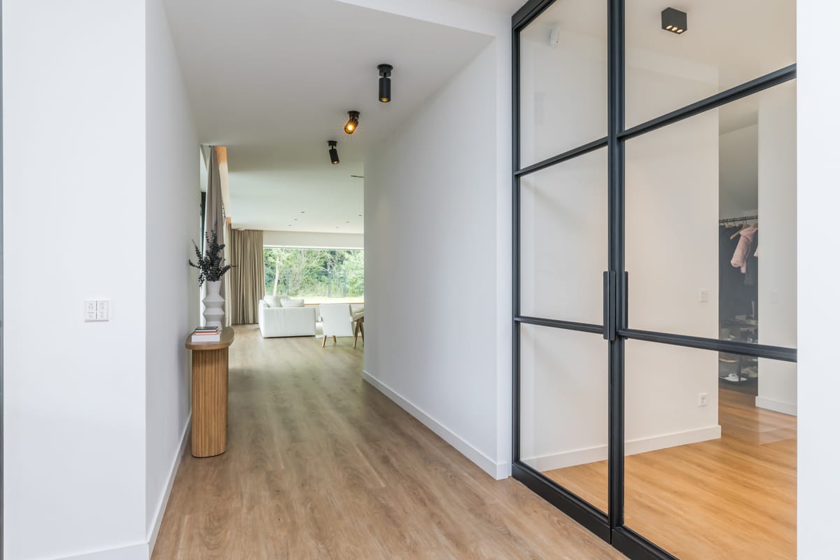 Corridor with steel-framed doors to the living room